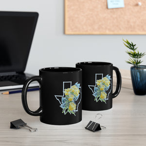 Two Yellow Roses of Texas Coffee Mugs sitting side by side, allowing you to see the front and back designs.
