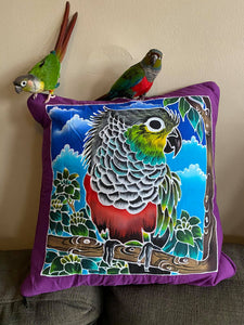 Model and friend posing with the Crimson-belled Conure handpainted batik throw pillow cover.