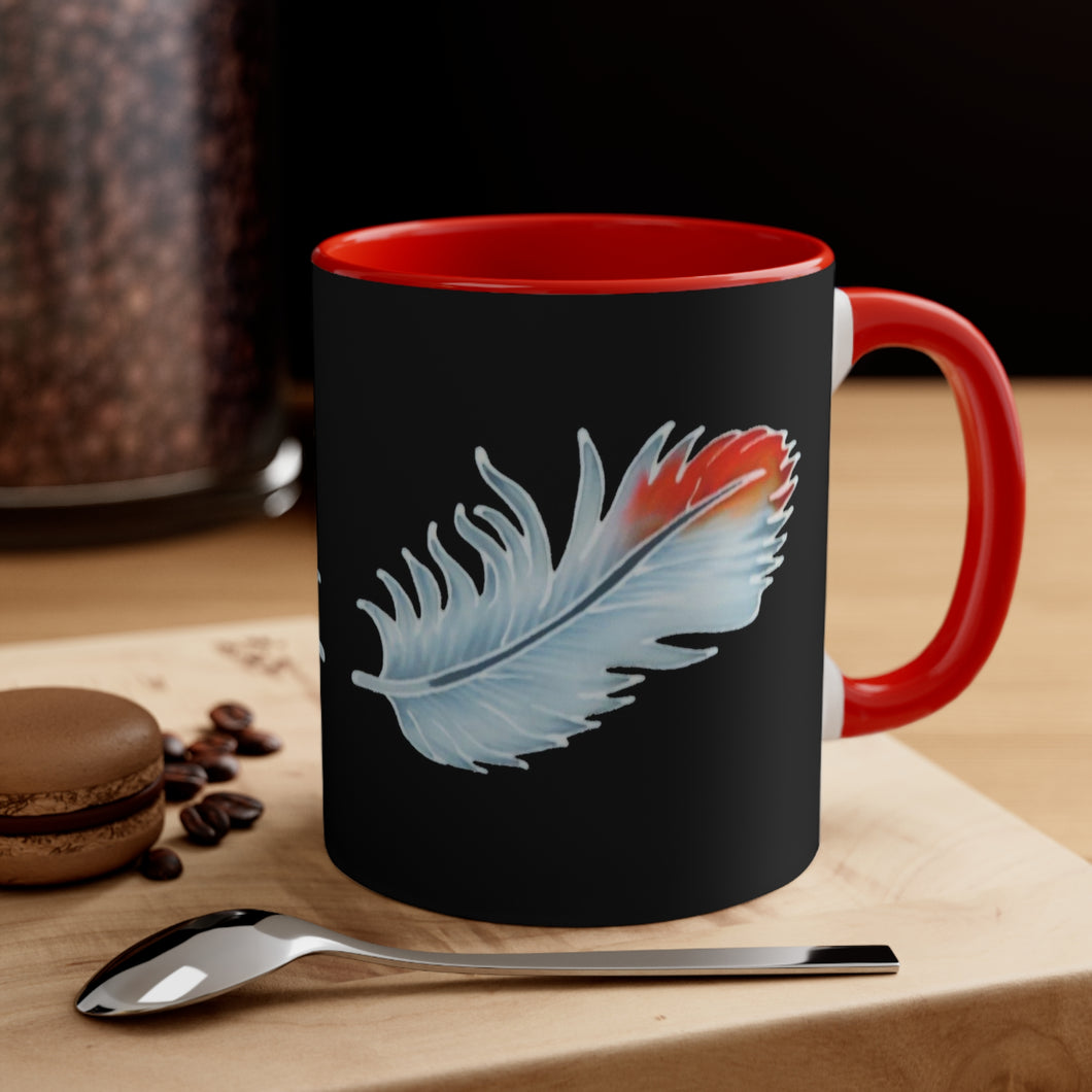 This versatile mug has a red interior and red handle. The design printed on the mug is two red-tipped African Grey parrot feathers set against a black background. What makes this design unique is real CAG feathers were the model for the handpainted batik design incorporated into our clothing products. The batik design was photographed to create this stunning mug.