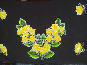 Stunning and eyecatching handpainted batik yellow roses sarong. A single rose has been batiked and painted by hand in each corner of the pareo. In the center, 3 bouquets  with greenery highlight this wardrobe accessory.