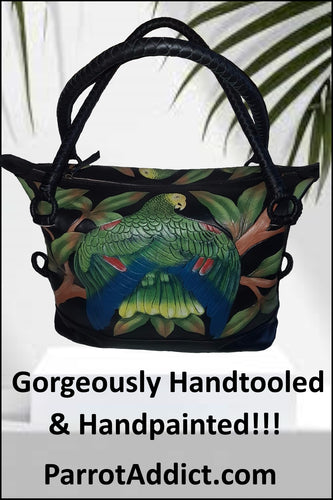 Beautifully handtooled and handpainted leather bag of a Double Yellow Headed Amazon parrot perched on a branch with its wings stretched out in all their glory, set amongst tropical foliage.
