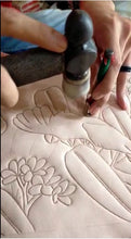 Hand-tooling of the Umbrella cockatoo leather bag.