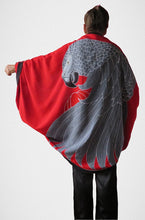 African Grey parrot hand-painted batik sarong worn as a jacket - back view with red background