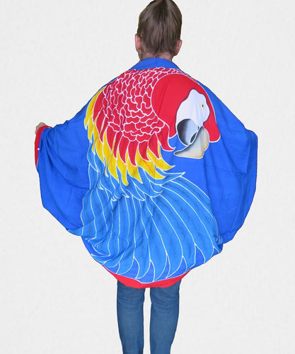 Handpainted batik Scarlet Macaw parrot sarong worn as a jacket