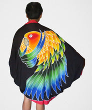 Sun Conure hand-painted batik sarong worn as a jacket