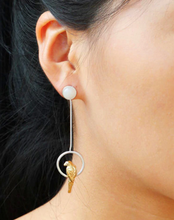 Sterling silver, hand-made parrot drop earrings worn by the model