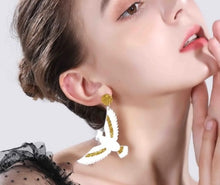 Cockatoo Parrot Bling Drop Pierced Earrings worn on a model
